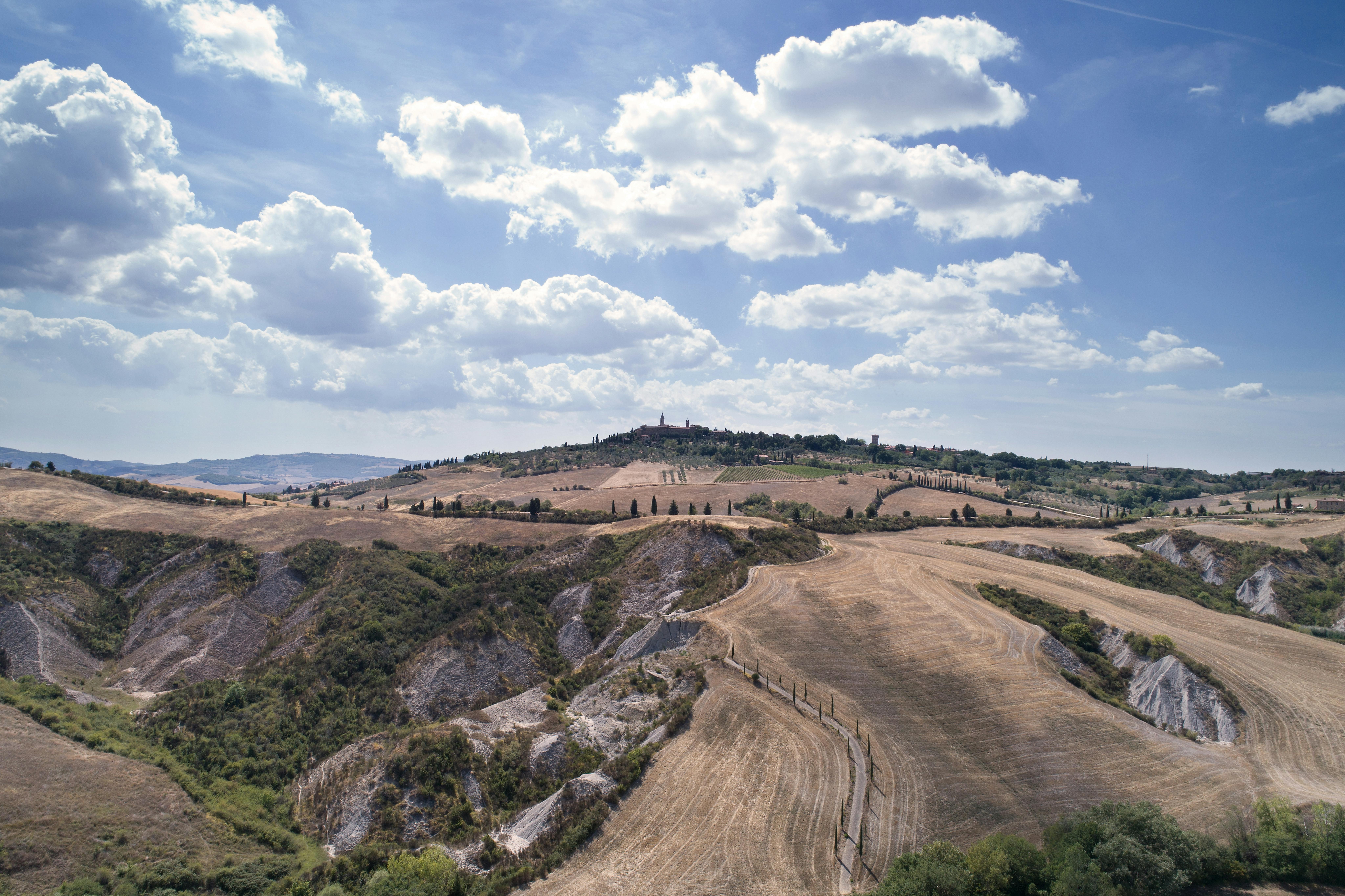 Aerial view by a drone of the landscape of the Val d'Orcia with Pienza in the background